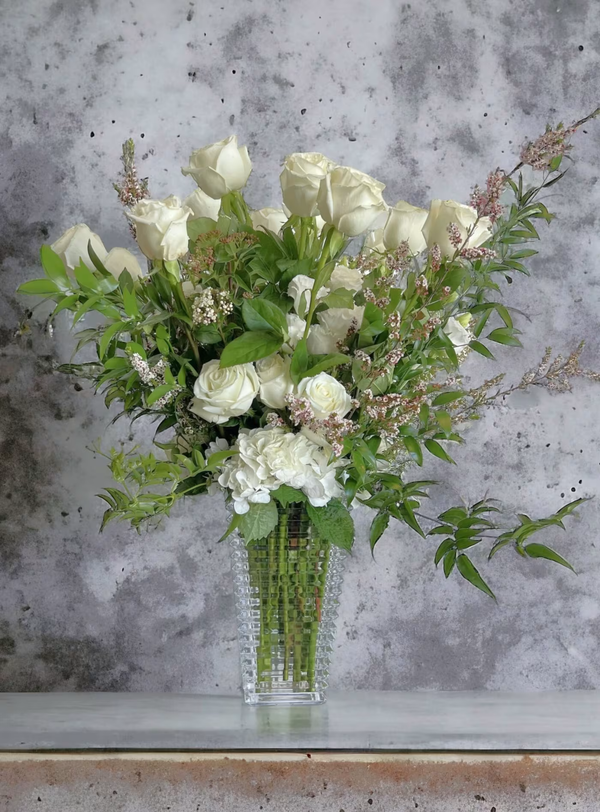 A stunning bouquet of a dozen white roses, perfect for any occasion, available for same-day delivery in Los Angeles