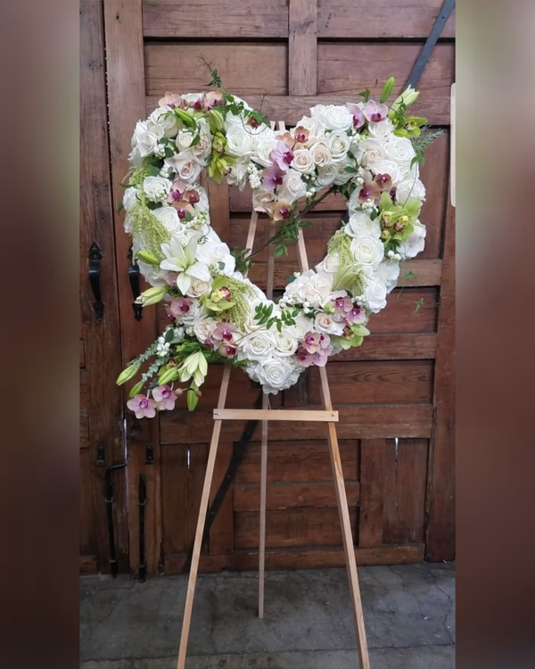 Eternal Love heart-shaped wreath, a romantic and elegant floral arrangement symbolizing everlasting love, perfect for weddings, anniversaries, or memorials, available for same-day delivery in Los Angeles.