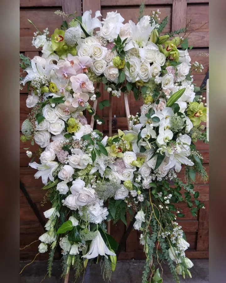 Free Flowing funeral floral arrangement, a graceful and serene tribute featuring soft blooms, ideal for memorials, funerals, or honoring a loved one, available for same-day delivery in Los Angeles