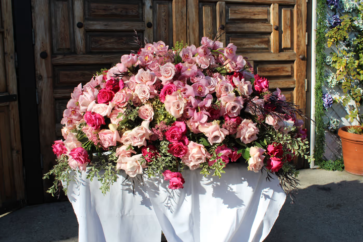 Elegant funeral spray floral arrangement, a beautiful and respectful tribute featuring soft blooms, ideal for memorials, funerals, and honoring loved ones, available for same-day delivery in Los Angeles.