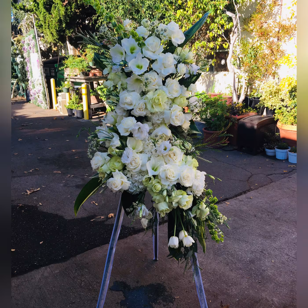 Elegant funeral floral arrangement, a respectful tribute featuring soft blooms, ideal for memorials and funerals, available for same-day delivery in Los Angeles to honor loved ones.