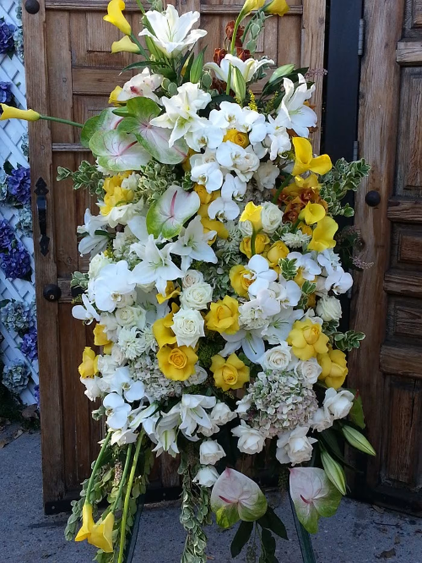 Mellow and Yellow funeral wreath, a warm and serene tribute featuring soft yellow blooms, ideal for memorials, funerals, and honoring loved ones, available for same-day delivery in Los Angeles.