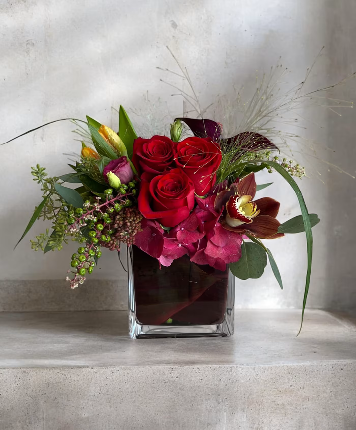 Merlot floral arrangement, featuring deep red and purple blooms, perfect for romantic occasions, anniversaries, or celebrations, available for same-day delivery in Los Angeles