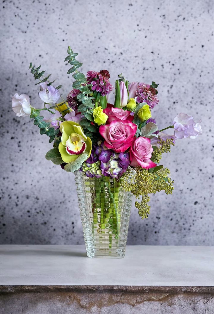 Purple Passion floral arrangement, a luxurious mix of purple blooms, ideal for anniversaries, romantic occasions, or special celebrations, available for same-day delivery in Los Angeles.